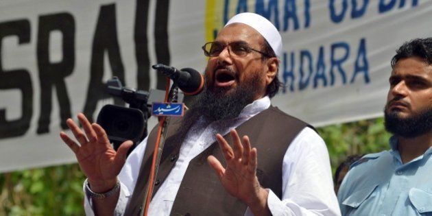 Pakistan chief of the Islamic hardline Jamaat ud Dawa (JuD) organisation Hafiz Mohammad Saeed addresses a pro-Palestinian demonstration held to protest against Israel's military campaign in Gaza, in Lahore on August 17, 2014. Indirect talks between Israelis and Palestinians for a long-term truce in Gaza resumed on August 17, 2104, with just over a day left before a temporary ceasefire is set to expire, a Palestinian official said. AFP PHOTO/Arif ALI (Photo credit should read Arif Ali/AFP/Getty Images)