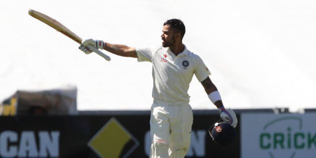 India's Virat Kohli reacts after reaching a century during the final day of their cricket test match against Australia in Adelaide, Australia, Saturday, Dec. 13, 2014. (AP Photo/James Elsby)