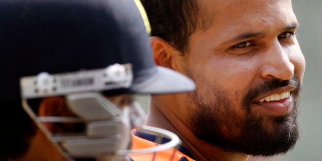 India's Yusuf Pathan smiles during a training session in the nets in Dhaka, Bangladesh, Sunday, March 11, 2012. India will play Sri Lanka in their first match of the Asia Cup Tuesday. (AP Photo/Pavel Rehman)