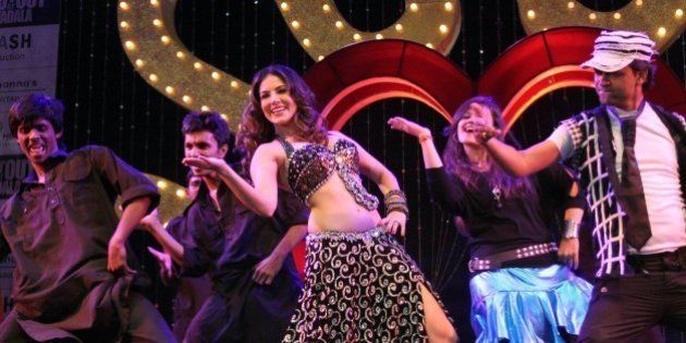 Adult film star Sunny Leone performs during a promotional event for the upcoming movie 'Shootout At Wadala' in Ahmadabad, India, Friday, April 26, 2013. The film based on growth of organized crime in late 70's and early 80's of Mumbai will be released on May 3, according to a press release. (AP Photo/Ajit Solanki)