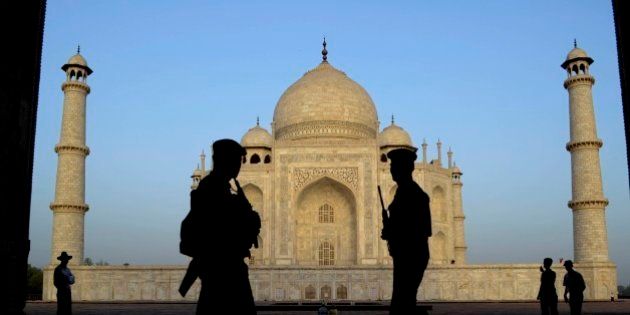 Indian paramilitary soldiers stand guard in front of the Taj Mahal in Agra, India, Wednesday, April 17, 2013. (AP Photo/Pawan Sharma)