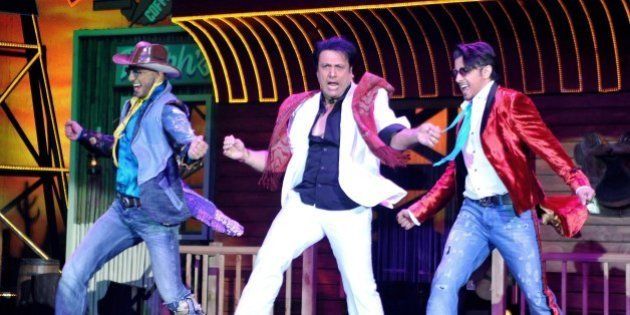 Indian Bollywood film actors Ranveer Singh, (L), Govinda (C) and Ali Zafar perform during the promotion of the upcoming Hindi film 'Kill/Dil' directed by Shaad Ali in Mumbai on October 31, 2014. AFP PHOTO (Photo credit should read STR/AFP/Getty Images)