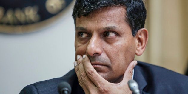 Raghuram Rajan, governor of the Reserve Bank of India (RBI), attends a news conference at the central bank's headquarters in Mumbai, India, on Tuesday, Dec. 2, 2014. Rajan left interest rates unchanged for a fifth straight meeting while signaling a possible easing early next year after Prime Minister Narendra Modis government called for lower borrowing costs. Photographer: Dhiraj Singh/Bloomberg via Getty Images