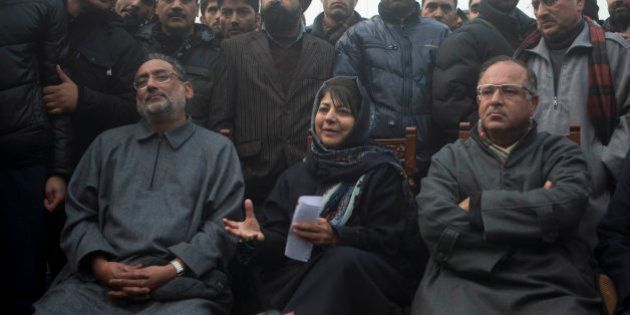 People's Democratic Party (PDP) leader Mehbooba Mufti, center, addresses the media at her residence in Srinagar, India, Tuesday, Dec. 23, 2014. The PDP won 28 seats and emerged as the single largest party in the recently concluded Jammu and Kashmir state elections. (AP Photo/Dar Yasin)