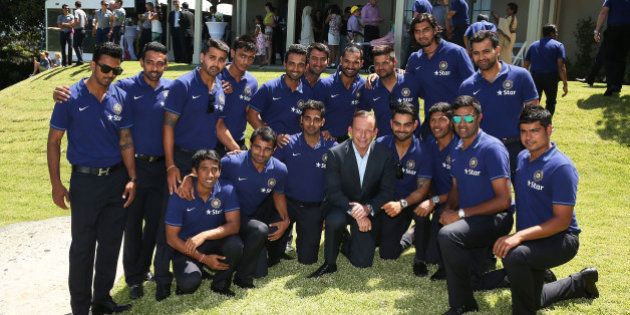 SYDNEY, AUSTRALIA - JANUARY 01: Australian Prime Minister, Tony Abbott poses for a photo with the Indian Test Cricket team during the Australian and Indian cricket team visit at Kirribilli House on January 1, 2015 in Sydney, Australia. (Photo by Brendon Thorne/Getty Images)