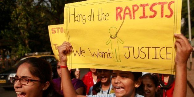 Indian students hold placards and shout slogans during a protest organized to create awareness on gender- based violence on women in Mumbai, India, Wednesday, Dec 10, 2014. The alleged rape by a driver of a taxi-booking service Uber in New Delhi last week, almost two years after a young woman was fatally gang raped on a bus in the capital, has renewed national anger over sexual violence in India and demands for more effort to ensure women's safety. (AP Photo/Rafiq Maqbool)