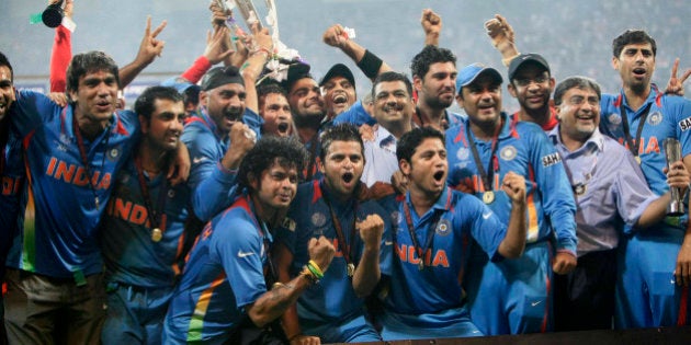 MUMBAI, INDIA - APRIL 02: Indian cricketers pose with the trophy after victory in the Cricket World Cup...