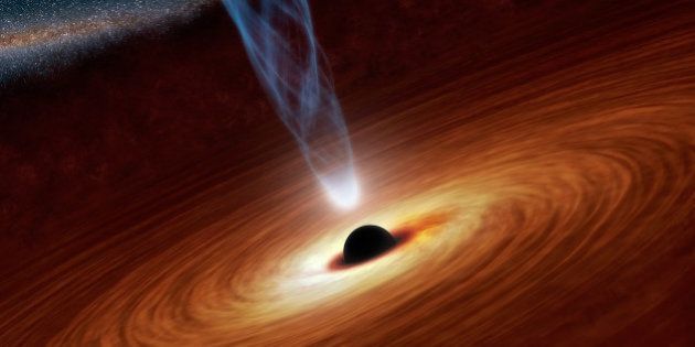 This illustration released by NASA, shows a supermassive black hole in the nearby spiral galaxy NGC 1365. A study published Thursday in the journal Nature calculated the spin rate of the black hole and found itâs rotating close to the speed of light. (AP Photo/NASA)