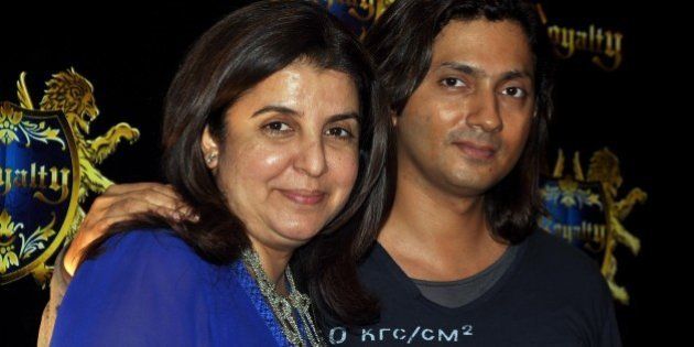Indian Bollywood film director and choreographer Farah Khan with husband Shirish Kunder to attend the pre-wedding party of Indian Bollywood actors Ritesh Deshmukh and Genelia Dâsouza in Mumbai on January 24, 2012. AFP PHOTO/STR (Photo credit should read STRDEL/AFP/Getty Images)