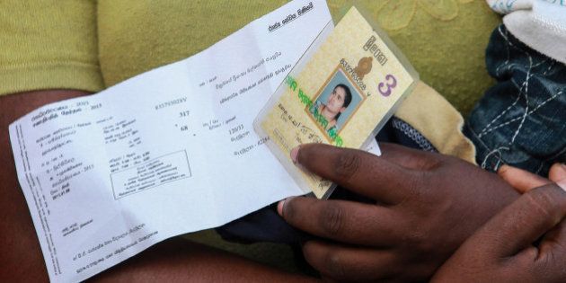 MADAMULANA, SRI LANKA - JANUARY 08 : Sri Lankan people wait to cast their votes at a polling station near Madamulana, 178 kilometers (110 miles) south of Colombo, Sri Lanka on January 08,2015. (Photo by Chamila Karunarathne /Anadolu Agency/Getty Images)