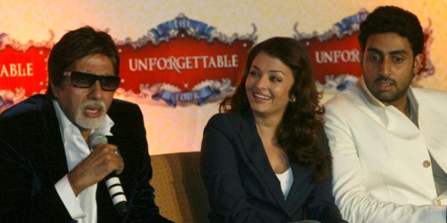 Bollywood actor, Aishwarya Rai Bachchan, center, and Abhishek Bachchan look on as Amitabh Bachchan, left, speaks during a press conference to announce the 'Unforgettable Tour' in Mumbai, India, Friday, July 11, 2008. Bollywood icon Amitabh Bachchan and Indian movie stars including son Abhishek and daughter-in-law Aishwarya Rai begin the 'Unforgettable Tour', a 40-day global concert next week to showcase India's film industry to overseas audiences. (AP Photo/Gautam Singh)
