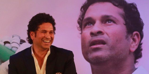 Retired cricket great Sachin Tendulkar smiles after launching his autobiography,