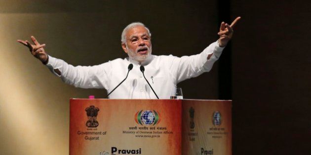 Indian Prime Minister Narendra Modi speaks during the Pravasi Bharatiya Divas (PBD) in Gandhinagar, India, Thursday, Jan. 8, 2015. Pravasi Bharatiya Divas (PBD) is an annual event to mark the contribution of overseas Indian community in the development of India. The three day event began in Gandhinagar on Wednesday. (AP Photo/Ajit Solanki)