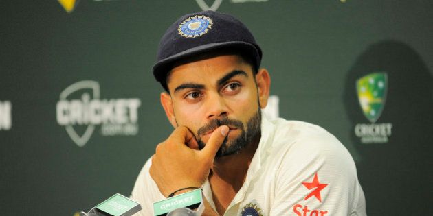 SYDNEY, AUSTRALIA - JANUARY 10: Virat Kohli of India looks on during day five of the Fourth Test match between Australia and India at Sydney Cricket Ground on January 10, 2015 in Sydney, Australia. (Photo by Brett Hemmings - CA/Cricket Australia/Getty Images)