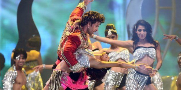 Bollywood actor Hrithik Roshan performs on stage during the fourth and final day of the 15th International Indian Film Academy (IIFA) Awards at the Raymond James Stadium in Tampa, Florida, April 27, 2014. AFP PHOTO/Jewel Samad (Photo credit should read JEWEL SAMAD/AFP/Getty Images)