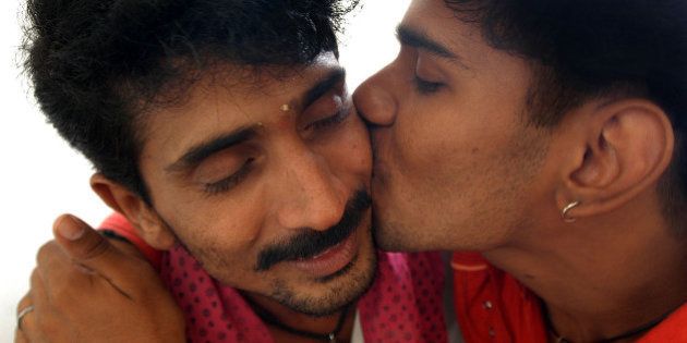 HIV positive Krishna, 21, left, gets kkiss from his partner Srinivasan, 34, also HIV positive, at a counseling centre on HIV/AIDS in Chennai, India, Thursday, Nov. 30, 2006. Srinivasan and Krishna are homosexual partners and also commercial sex workers for male clients. World Aids Day will be observed on Dec. 1. (AP Photo/ M.Lakshman)** INDIA OUT**