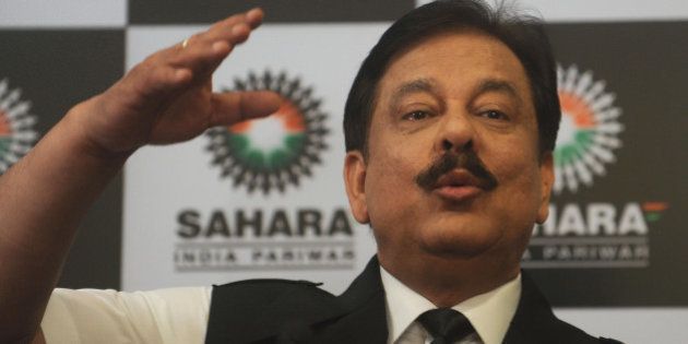 Subrato Roy, chairman of the Sahara Group gestures as he speaks during a news conference in Mumbai on February 4, 2012. Indian cricket was hit by a major crisis on February 4 when the long-time sponsor of the national cricket team pulled out over differences with the board. The Sahara group of companies, which has been a cricket sponsor since 2000, said in a statement that it was ending what it called a 'one-sided emotional relationship' with the Board of Control for Cricket in India (BCCI). AFP PHOTO/ Punit PARANJPE (Photo credit should read PUNIT PARANJPE/AFP/Getty Images)