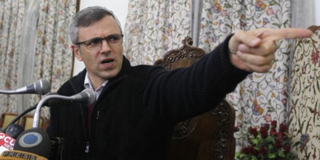 SRINAGAR, INDIA - DECEMBER 22: The Jammu and Kashmir Chief Minister and National Conference leader Omar Abdullah addressing press conference on December 22,2014 in Srinagar, India. As political parties work on strategies and possible alliances in the light of two exit polls projecting a hung house in Jammu and Kashmir, Omar asserted that it was inconceivable for his party to go with the BJP. (Photo by Waseem Andrabi/Hindustan Times via Getty Images)