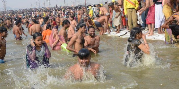 ALLAHABAD, INDIA â JANUARY 14: Millions of devout Hindus, led by naked ascetics with ash smeared on their bodies, plunged into the frigid waters of the Ganga on Monday, in a ritual they believe can wash away their sins.(Photo by Vikram Sharma/India Today Group/Getty Images)