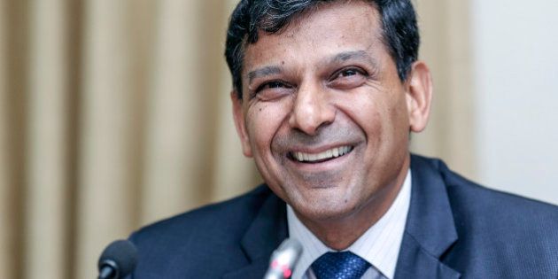 Raghuram Rajan, governor of the Reserve Bank of India (RBI), reacts during a news conference at the central bank's headquarters in Mumbai, India, on Tuesday, Dec. 2, 2014. Rajan left interest rates unchanged for a fifth straight meeting while signaling a possible easing early next year after Prime Minister Narendra Modis government called for lower borrowing costs. Photographer: Dhiraj Singh/Bloomberg via Getty Images