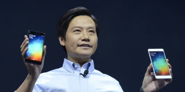 BEIJING, CHINA - JANUARY 15: (CHINA OUT) Lei Jun, chairman and CEO of China's Xiaomi Inc. presents the company's new product, the Mi Note on January 15, 2015 in Beijing, China. China's leading smartphone maker Xiaomi Inc. presented their new smartphone the 'Mi Note' today, which is expected provide strong competition for the Apple iPhone 6 Plus. (Photo by ChinaFotoPress/ChinaFotoPress via Getty Images)