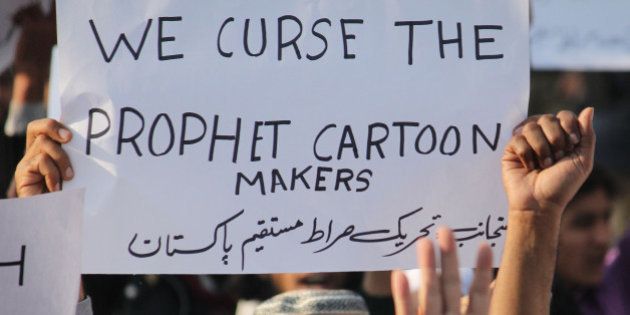 LAHORE, PUNJAB, PAKISTAN - 2015/01/15: Activits of a Pakistani religious Party (Tehreek-e-Siraat-e-Mustaqeem Pakistan) protest against the Satirical French weekly Charlie Hebdo Magazine, publishing of blasphemous sketches of the Prophet Muhammad as the cover of its first edition that caused them attack by Islamist gunmen. Pakistani lawmakers passed a resolution and marched outside parliament to protest the publication of images of Islams prophet and made placards in local language read 'we are ready to die in the name of the Prophet.'. (Photo by Rana Sajid Hussain/Pacific Press/LightRocket via Getty Images)