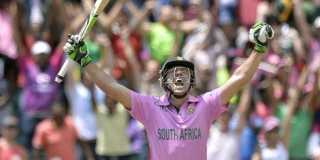 South African batsman AB de Villiers celebrates scoring a century (100 runs) during the second One Day International cricket match between South Africa and the West Indies at Wanderers cricket ground in Johannesburg on January 18, 2015. AFP PHOTO / STRINGER=RESTRICTED TO EDITORIAL USE= (Photo credit should read STRINGER/AFP/Getty Images)
