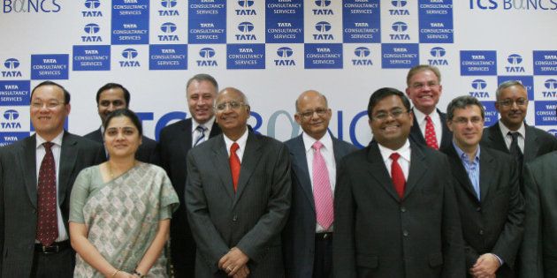 Tata Consultancy Services Ltd. (TCS) Chief Executive Officer and Managing Director S. Ramadorai, fifth from left, poses with the members of TCS Financial Solutions team after a press conference in Bangalore, India, Monday, Aug. 6, 2007. TCS, India's top software company, said Monday it has a pipeline of 150 orders ranging from USD 5 million to USD 200 million in the financial services, banking and insurance solutions over the next 12 to 18 months. TCS Financial Solution senior officials President N.G. Subramaniam, fifth from right, Head of Global Sales Robert U. Mullen, second right, and Chief Marketing Officer Dennis Roman, third right, are also seen. (AP Photo/Aijaz Rahi)