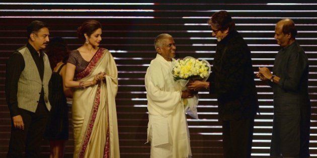 Bollywood film star Amitabh Bachchan (2R) felicitates music director Ilaiyaraaja (C) as film actors Sridevi (2L), Rajinikanth (R) and Kamal Haasan look on during the music launch of new film 'Shamitabh' in Mumbai on January 20, 2015. 'Shamitabh' is scheduled for release on February 6, 2015. AFP PHOTO / PUNIT PARANJPE (Photo credit should read PUNIT PARANJPE/AFP/Getty Images)