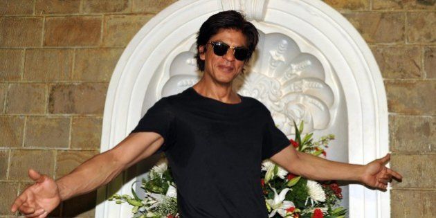 Indian Bollywood actor Shah Rukh Khan poses for a photograph during a photocall for his 49th birthday celebrations at his home in Mumbai on November 2, 2014. AFP PHOTO/STR (Photo credit should read STRDEL/AFP/Getty Images)