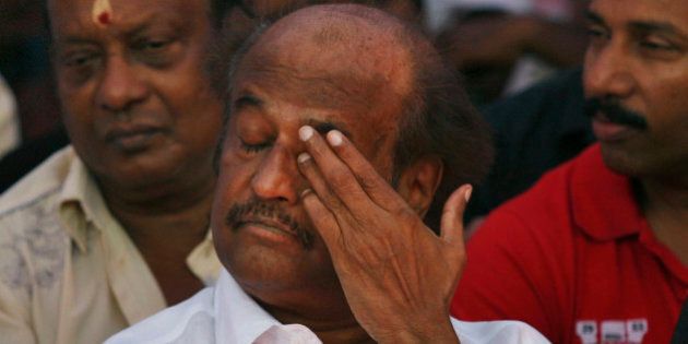 Indian Tamil superstar Rajnikanth gestures as he sits with other Tamil movie stars during a day long fast in Chennai, India, Tuesday, April 2, 2013, demanding probe into alleged wartime abuses by Sri Lanka. The stars are fasting for a day to protest what they say is the mistreatment of ethnic Tamils in neighboring Sri Lanka and to demand an international probe into alleged wartime abuses there. A U.N. investigation into the final months of the war indicated that the ethnic Sinhalese-dominated government might have killed as many as 40,000 Tamil civilians. (AP Photo/Arun Sankar K)