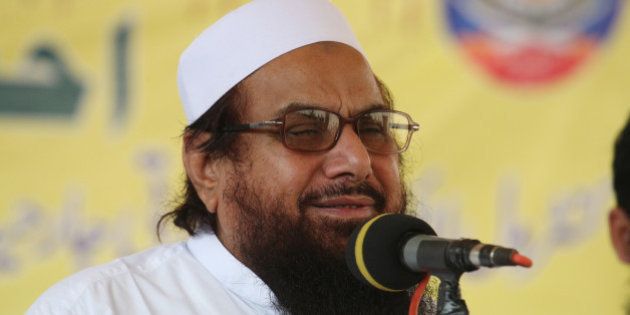 Hafiz Saeed, the leader of anti-Indian group Jammatud Dawa, addresses a rally against India, Friday, Oct. 10, 2014 in Lahore, Pakistan. Fighting in Kashmir between India and Pakistan subsided on Friday as Pakistanâs Prime Minister Nawaz Sharif met with advisers and military chiefs to discuss the latest spasm of violence in the disputed Himalayan region, which has killed at least 21 civilians over the past week. (AP Photo/K.M. Chaudary)