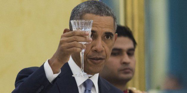 US President Barack Obama makes a toast during a State Dinner at Rashtrapati Bhawan, the Presidential Palace, in New Delhi, India, January 25, 2015. AFP PHOTO / SAUL LOEB (Photo credit should read SAUL LOEB/AFP/Getty Images)
