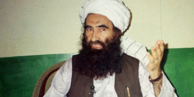 FILE - In this Aug. 22, 1998, file photo, Jalaluddin Haqqani, then the Taliban Army Supreme Commander, talks to reporters in Miram Shah, Waziristan, Pakistan. One of the deadliest militant groups in Afghanistan, the Haqqani network, has developed a sophisticated, mafia-style financing operation that relies on illegal activities, such as extortion, kidnapping and smuggling, and ties to legitimate businesses, according to a new report by a U.S.-based think tank. (AP Photo/Mohammad Riaz, File)