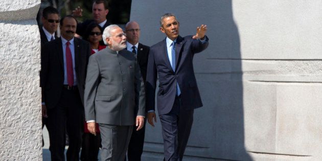 President Barack Obama escorts Indian Prime Minister Narendra Modi at the Martin Luther King Jr. Memorial in Washington, Tuesday, Sept. 30, 2014. President Barack Obama and India's new Prime Minister Narendra Modi said Tuesday that
