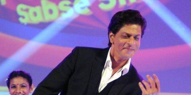Indian Bollywood actor Shah Rukh Khan during the launch of the new Hindi general entertainment television channel '&TV' and its flagship show 'Poochega Sabse Shaana Kaun' in Mumbai on January 21, 2015. AFP PHOTO/STR (Photo credit should read STRDEL/AFP/Getty Images)