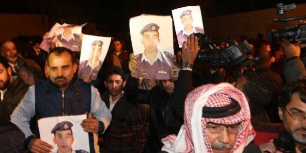 AMMAN, JORDAN - JANUARY 28: Jordanian pilot Maaz al-Kassasbeh's relatives stage a demonstration in front of the Royal Palace, demanding the release of Sajida al-Rishawi in Amman, Jordan on January 28, 2015. Islamic State of Iraq and Levant (ISIL) threatened to kill al-Kassasbeh and a Japanese journalist within 24 hours if Jordan will not release the jailed Iraqi militant al-Rishawi. (Photo by Salah Malkawi/Anadolu Agency/Getty Images)