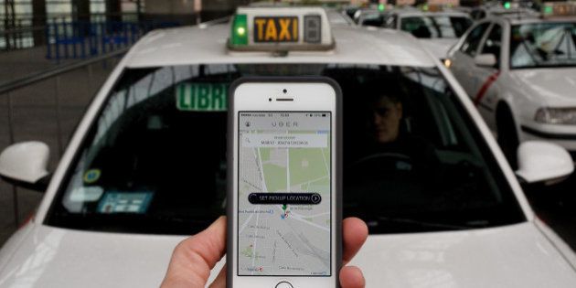 MADRID, SPAIN - OCTOBER 14: In this photo illustration the new smart phone taxi app 'Uber' shows how to select a pick up location at Atocha Station on October 14, 2014 in Madrid, Spain. 'Uber' application started to operate in Madrid last September despite Taxi drivers claim it is an illegal activity and its drivers currently operate without a license. 'Uber' is an American based company which is quickly expanding to some of the main cities from around the world. (Photo by Pablo Blazquez Dominguez/Getty Images)
