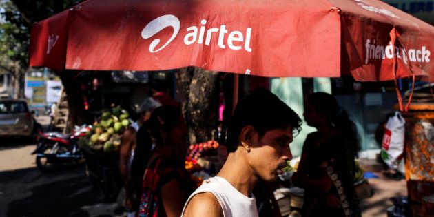 The logo of Bharti Airtel Ltd. is displayed on a parasol in Mumbai, India, on Wednesday, Jan. 29, 2014. India got bids totaling 446.1 billion rupees ($7.12 billion) on the first day of a wireless spectrum auction on Feb. 3, the third effort by the government to raise revenue from the sale of airwaves in the last 15 months. Photographer: Dhiraj Singh/Bloomberg via Getty Images