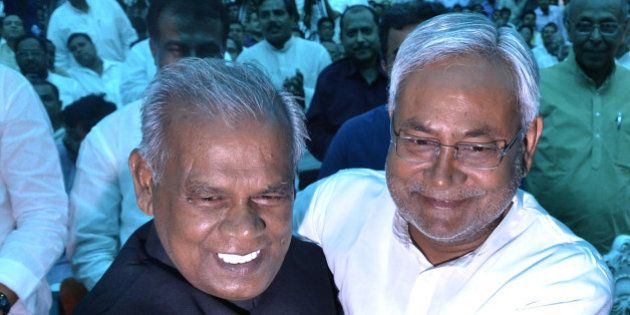 PATNA, INDIA - MAY 20: JD-U leader Jitan Ram Manjhi (L) with Nitish Kumar during his sworn-in ceremony as the new Chief Minister of Bihar, on May 20, 2014 in Patna, India. Manjhi currently hold the SC/ST, OBS, EBC Welfare Ministry. He is a Mahadalit from the Musahar community who occupy the lowest strata of the society in the state. Nitish Kumar, who quit as Bihar's Chief Minister after his Janata Dal United lost the national election, has chosen his close aide Jitan Ram Manjhi as his successor. (Photo by Santosh Kumar/Hindustan Times via Getty Images)