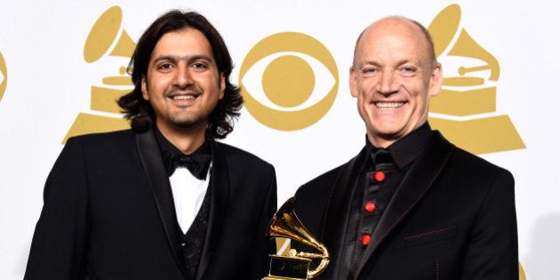 LOS ANGELES, CA - FEBRUARY 08: Musicians Ricky Kej (L) and Wouter Kellerman, winners of the Best New Age Album Award for 'Winds of Samsara' pose in the press room during The 57th Annual GRAMMY Awards at the STAPLES Center on February 8, 2015 in Los Angeles, California. (Photo by Frazer Harrison/Getty Images)