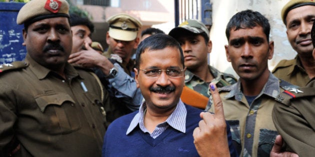 Aam Aadmi Party, or Common Man's Party, leader Arvind Kejriwal displays the indelible ink mark on his finger after casting his vote in New Delhi, India, Saturday, Feb. 7, 2015. Voters cast ballots in the Indian capital on Saturday in an election that is seen as a litmus test for the popularity of Prime Minister Narendra Modi and his Hindu nationalist party. Opinion polls ahead of the vote to choose New Delhi's 70-member assembly suggest that Modi's Bharatiya Janata Party is either locked in a close contest with the upstart Common Man's Party or will come in second. (AP Photo/Altaf Qadri)