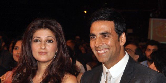 Indian Bollywood Akshay Kumar (R) and wife Twinkle Khanna (L) look on as they attend the 'Stardust Awards 2011' ceremony in Mumbai on February 6, 2011. AFP PHOTO/STR (Photo credit should read STRDEL/AFP/Getty Images)