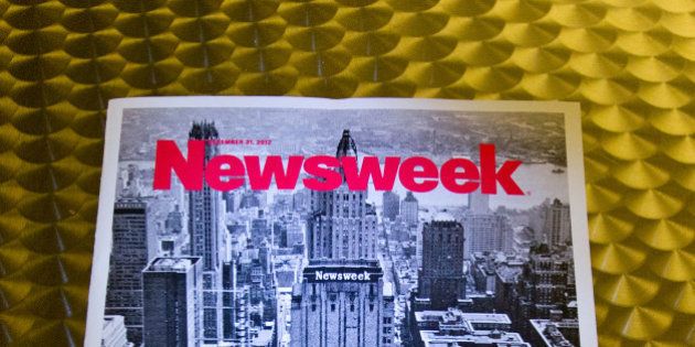 This December 24, 2012 photo shows the final print edition of Newsweek, seen here in Washington, DC. Newsweek ends its 80-year run as a weekly news magazine with a final print edition published this week with a December 31, 2012 date. The magazine went with a vintage photo of its old Midtown Manhattan headquarters in New York for the cover shot and a Twitter hashtage headline of '#lastprintissue.â AFP PHOTO / Karen BLEIER (Photo credit should read KAREN BLEIER/AFP/Getty Images)