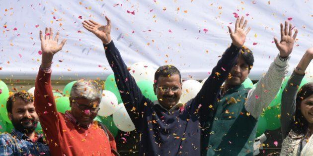 NEW DELHI,INDIA FEBRUARY 10: Aam Aadmi Party (AAP) chief and its chief ministerial candidate for Delhi, Arvind Kejriwal (C) waving to his supporters in New Delhi.(Photo by Pankaj Nangia/India Today Group/Getty Images)