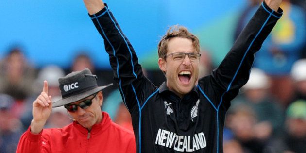 New Zealand's Daniel Vettori, right, celebrates the wicket, confirmed by umpire Nigel Long, left, of Sri Lanka's Mahela Jayawardene for no score during the opening match of the Cricket World Cup at Christchurch, New Zealand, Saturday, Feb. 14, 2015. (AP Photo/Ross Setford)