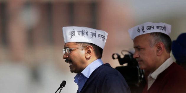 Aam Aadmi Party, or Common Man's Party, leader Arvind Kejriwal addresses the crowd after taking oath as Chief Minister of Delhi, with Cabinet Minister Manish Sisodia standing beside him in New Delhi, India, Saturday, Feb. 14, 2015. The AAP, headed by the former tax official who had remade himself into a champion for clean government, won 67 of the 70 seats in recent elections. Kejriwal and the party he created routed the country's best-funded and best-organized political machine and dealt an embarrassing blow to Prime Minister Narendra Modi. (AP Photo/Altaf Qadri)