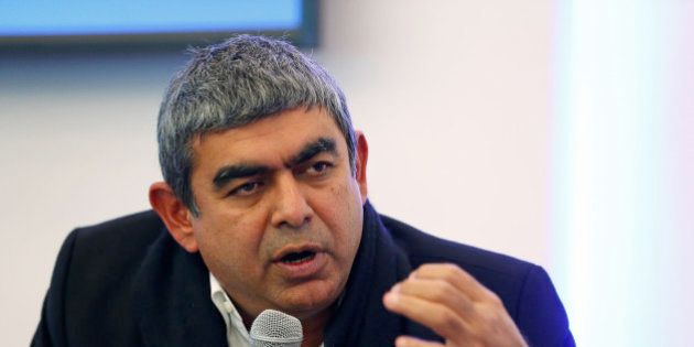 Vishal Sikka, chief executive officer of Infosys Ltd., gestures as he speaks during a session on the opening day of the World Economic Forum (WEF) in Davos, Switzerland, on Wednesday, Jan. 21, 2015. World leaders, influential executives, bankers and policy makers attend the 45th annual meeting of the World Economic Forum in Davos from Jan. 21-24. Photographer: Jason Alden/Bloomberg via Getty Images