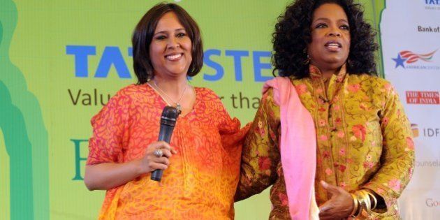 Television talk show host Oprah Winfrey (R) poses with Indian Journalist Barkha Dutt during the Jaipur Literature Festival (JLF) in Jaipur on January 22, 2012. Television chatshow queen Oprah Winfrey received a rock star's welcome when she spoke on Sunday to a heaving audience of thousands of fans at the Jaipur Literature Festival in India. Winfrey, wearing a gold and red Indian outfit, told the packed crowd that her love of books had helped her education and enabled her to rise from a poor childhood in Mississippi to become one of the world's most influential women. AFP PHOTO / Prakash SINGH (Photo credit should read PRAKASH SINGH/AFP/Getty Images)