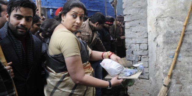NEW DELHI, INDIA - JANUARY 8: Union Minister for Human Resource Development Smriti Irani participating in Swachh Bharat Abhiyan organized by ABVP & DUSU at Sanjay Basti, Timarpur on January 8, 2015 in New Delhi, India. (Photo by Sushil Kumar/Hindustan Times via Getty Images)